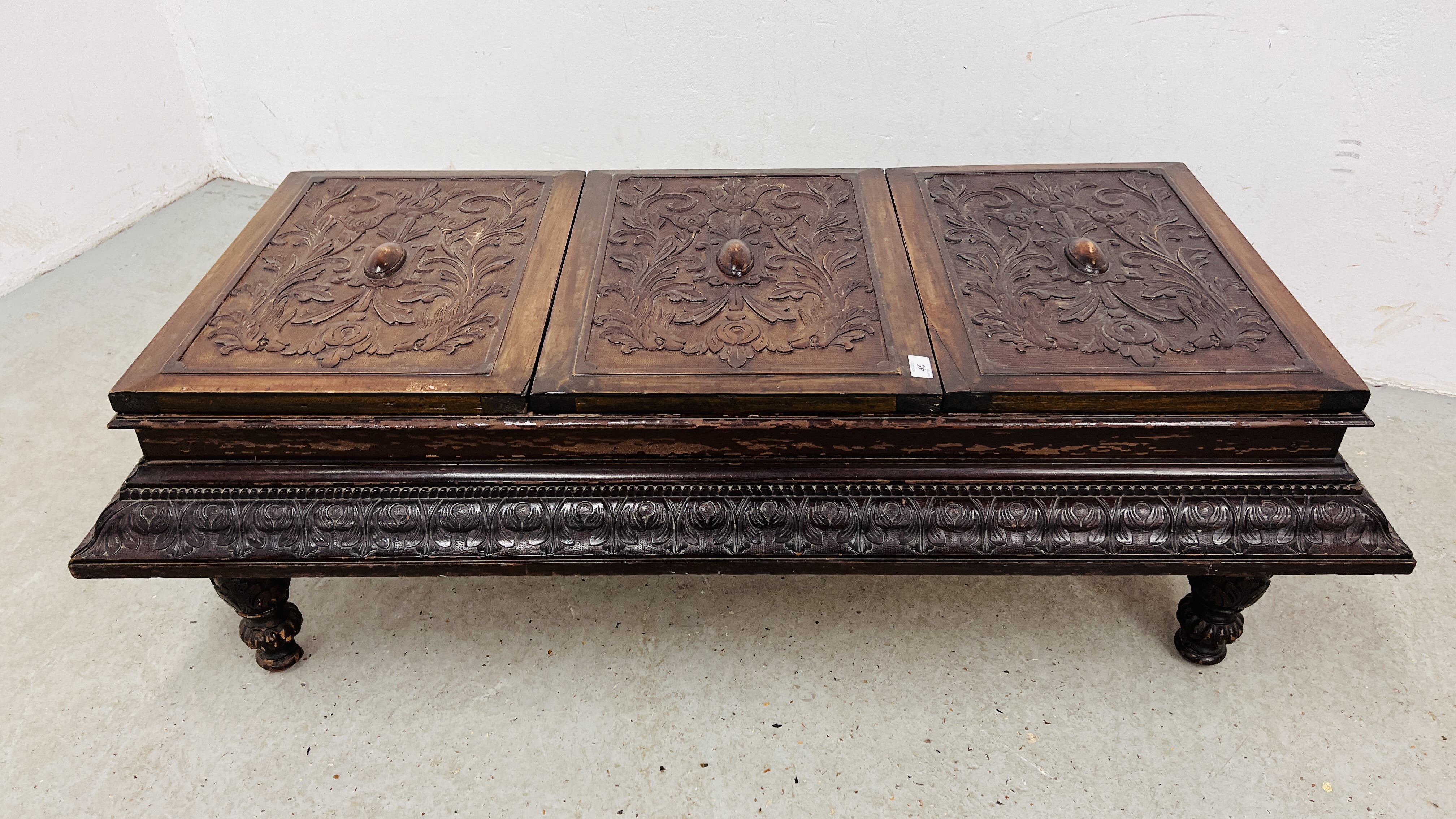 A CARVED VINTAGE THREE PANELLED TOP LOW CHEST, W 135CM, D 66CM, H 42CM WITH EACH LID BEING 40.