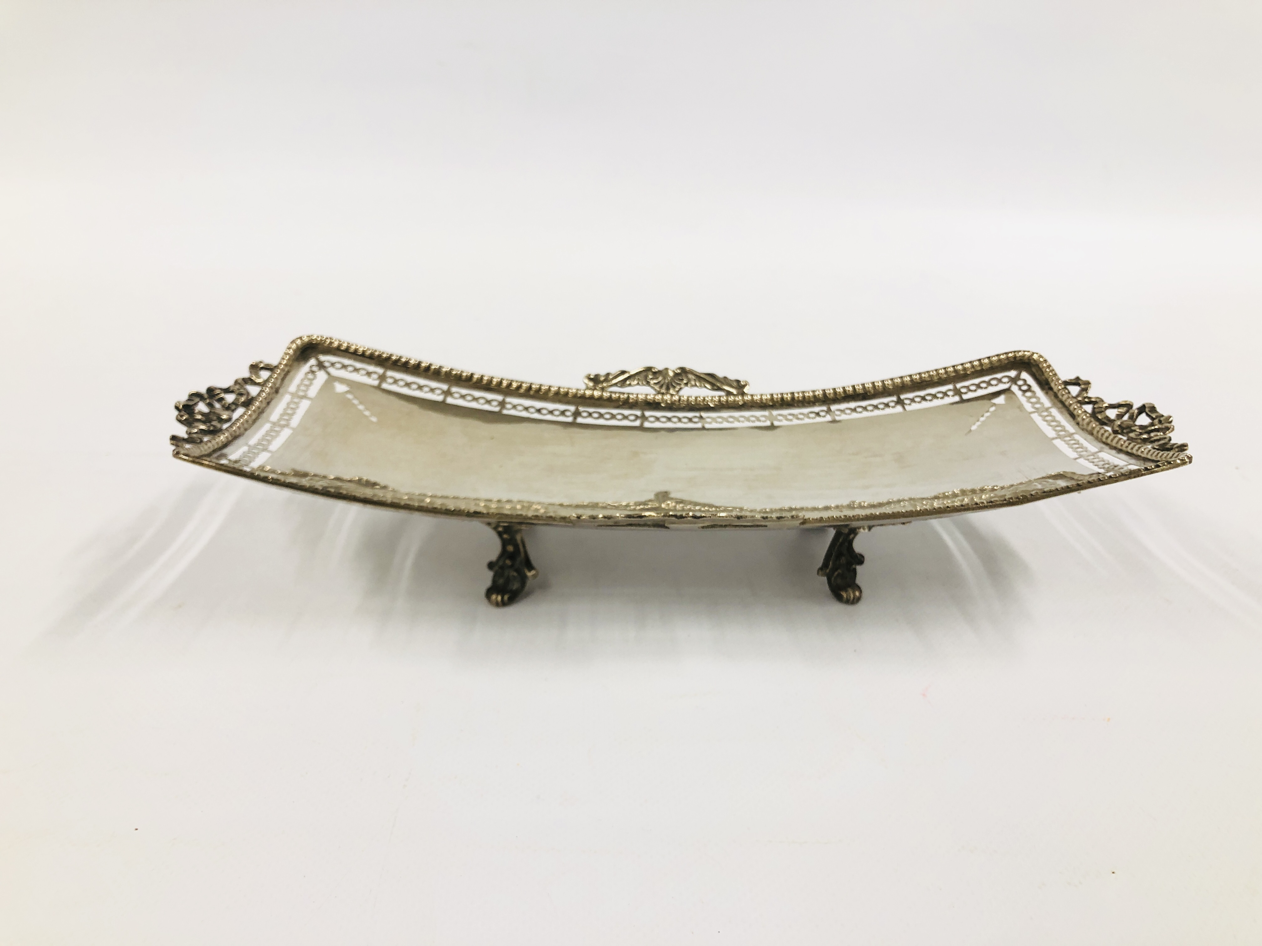 AN ELABORATE SILVER RECTANGULAR DISH, OPEN WORK DETAIL ON FOUR SPLAYED FEET, STAMPED 800, L 33CM,