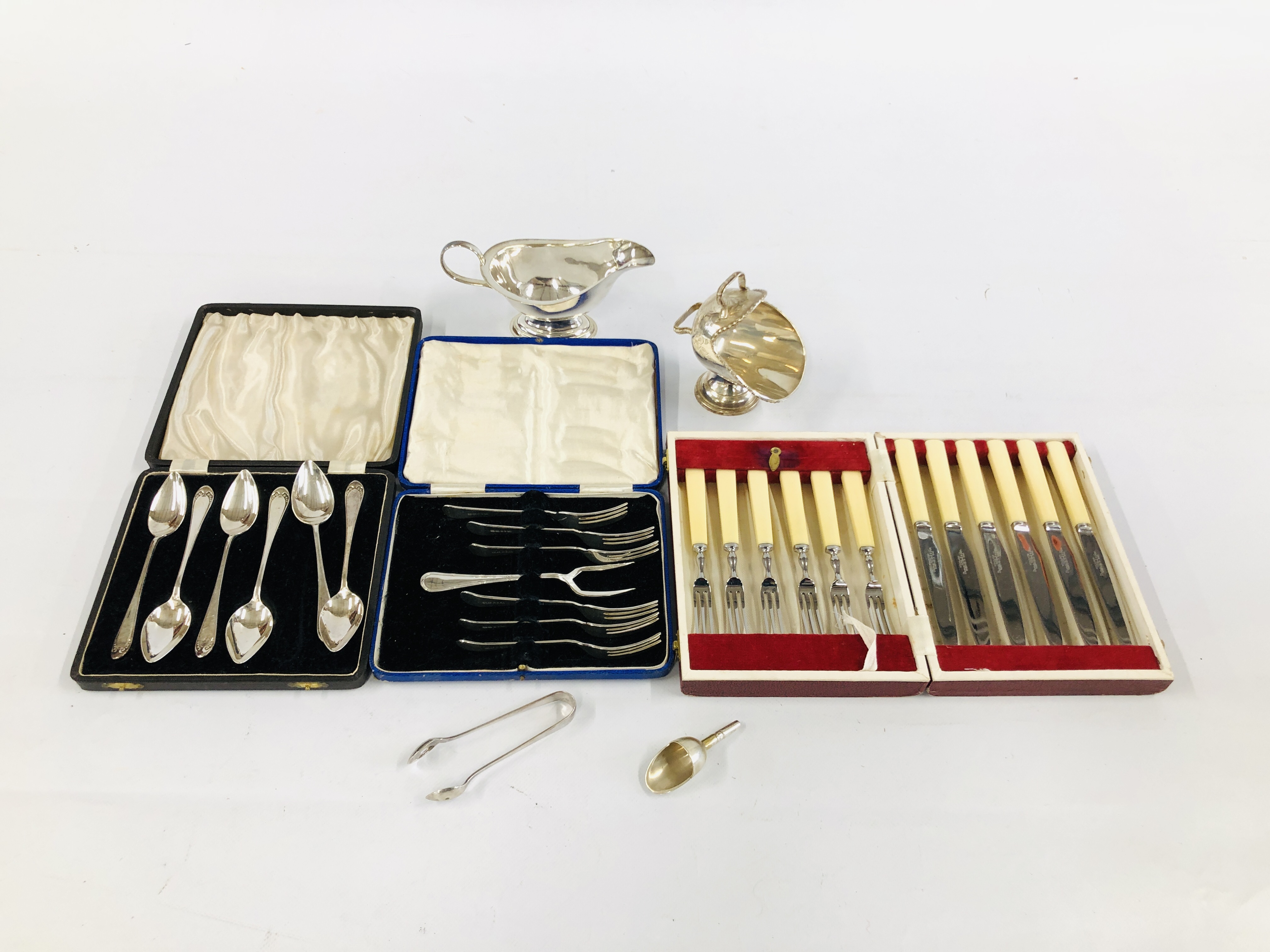 A CASED SET OF SIX GRAPEFRUIT SPOONS, CASED SET OF SIX CAKE FORKS AND SERVER,