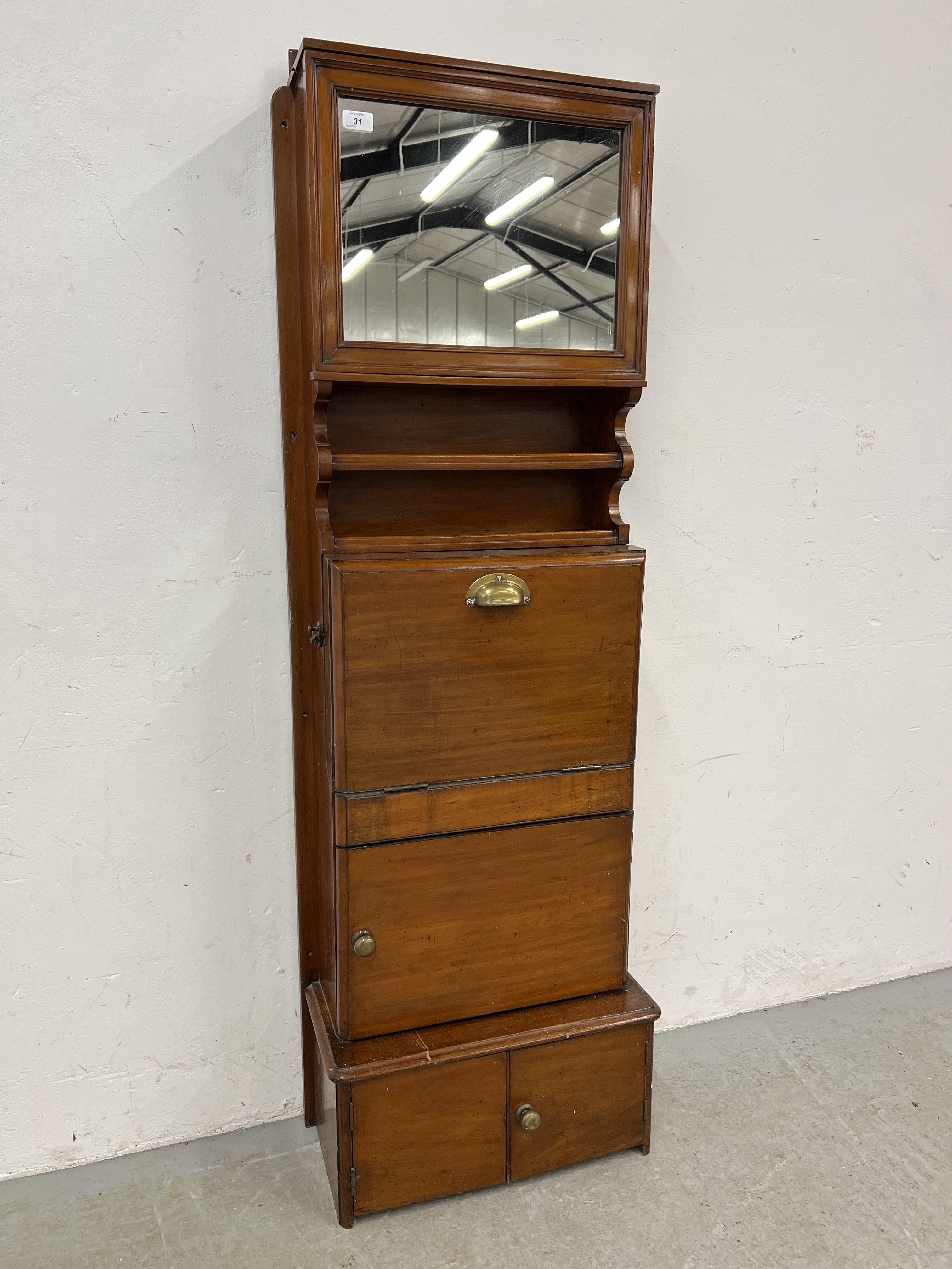 A VICTORIAN MAHOGANY SHIP'S WASH STAND WITH MIRRORED DOOR ABOVE - W 54CM X D 29CM X H 164CM.