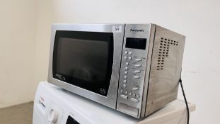 A STAINLESS STEEL PANASONIC MICROWAVE - SOLD AS SEEN.