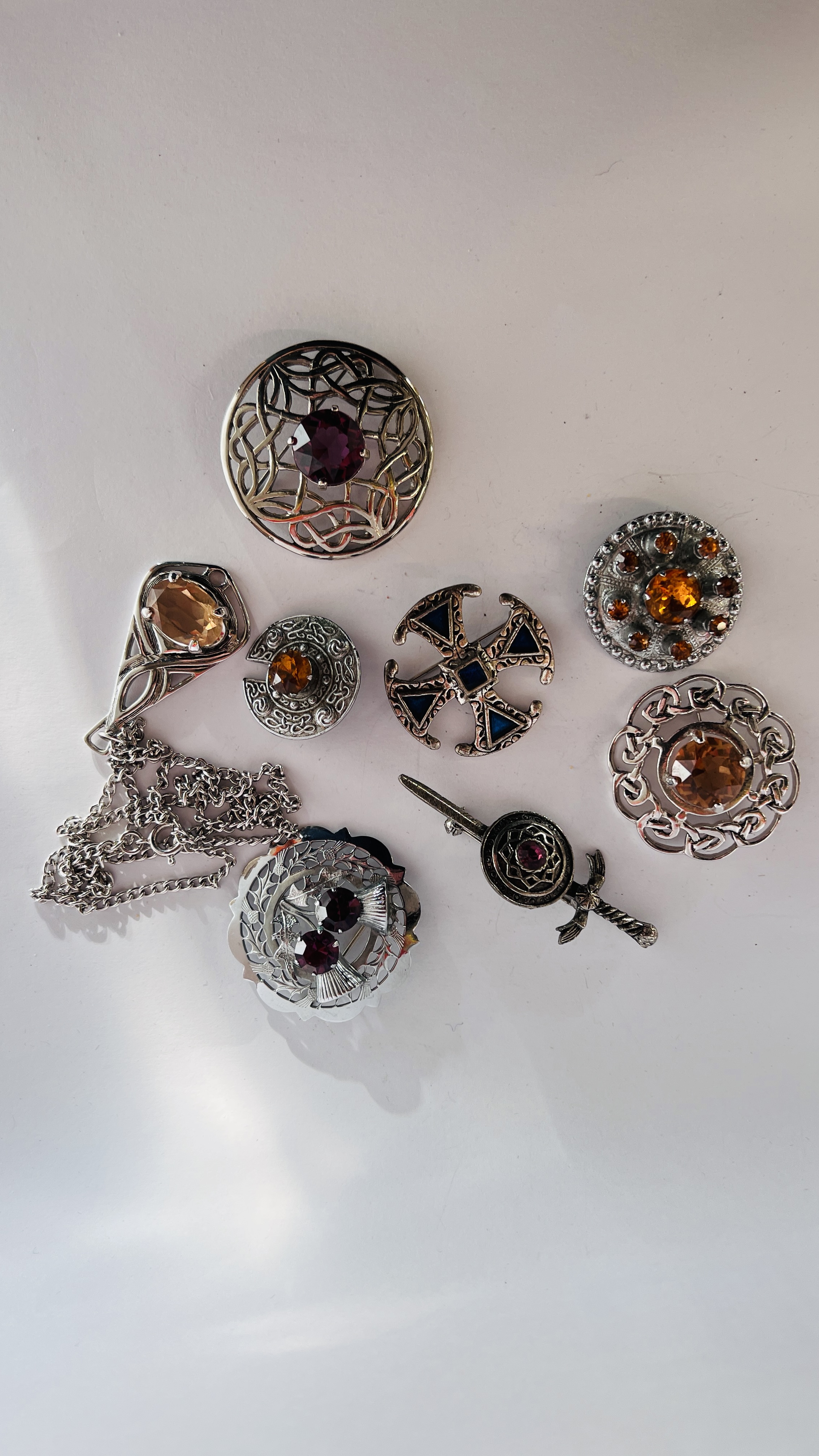 SELECTION OF SEVEN "MIZPAH" & "MIRACLE" SCOTTISH AND CELTIC GLASS BROOCHES AND NECKLACE