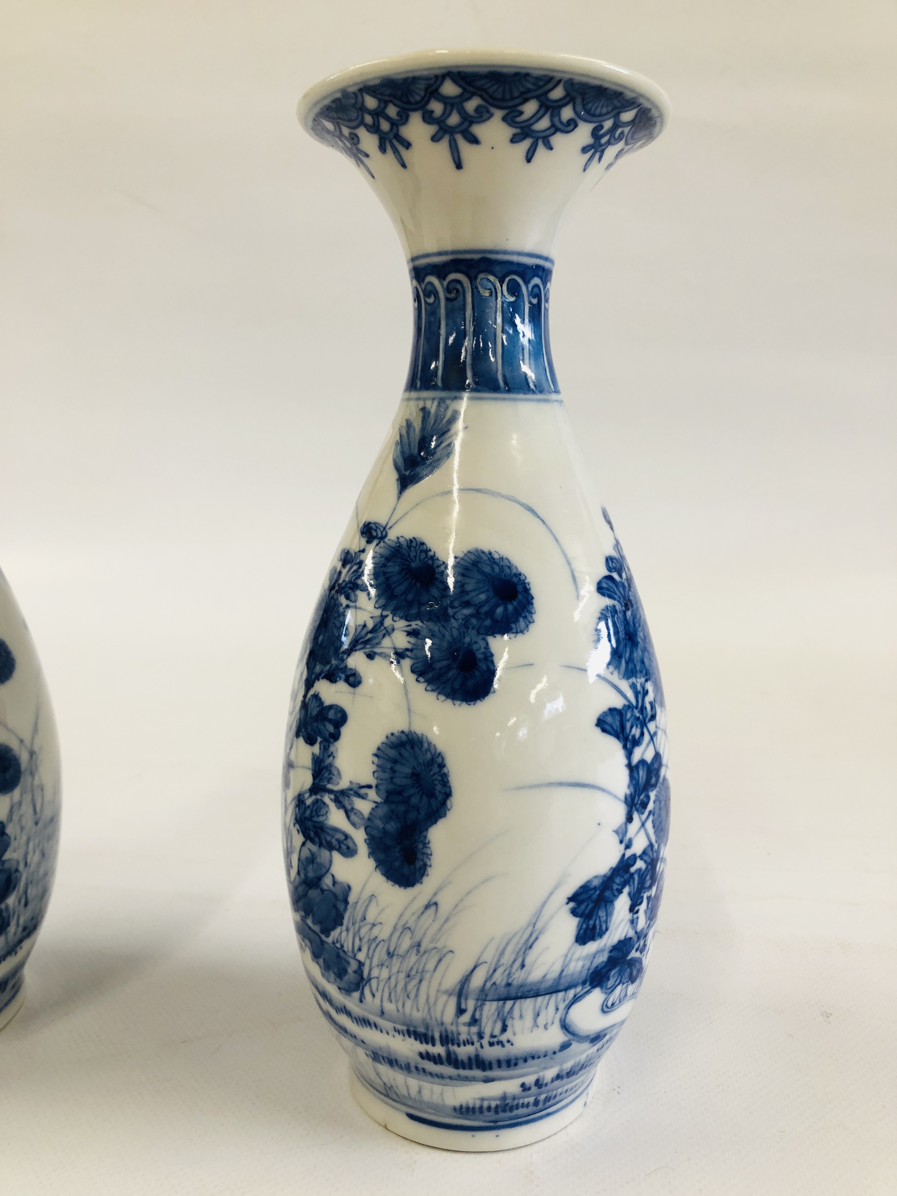 A PAIR OF DECORATIVE BLUE AND WHITE ORIENTAL VASES DEPICTING A PREGNANT WOMAN SEATED AMONGST THE - Image 7 of 13