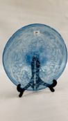 A CIRCULAR DISH, THE BLUE GLASS WITH DAPPLED DECORATION UNSIGNED - 45CM. DIAMETER.