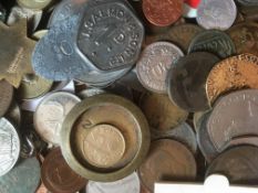 LARGE WOOD TRAY OF WORLD COINS AND TOKENS.