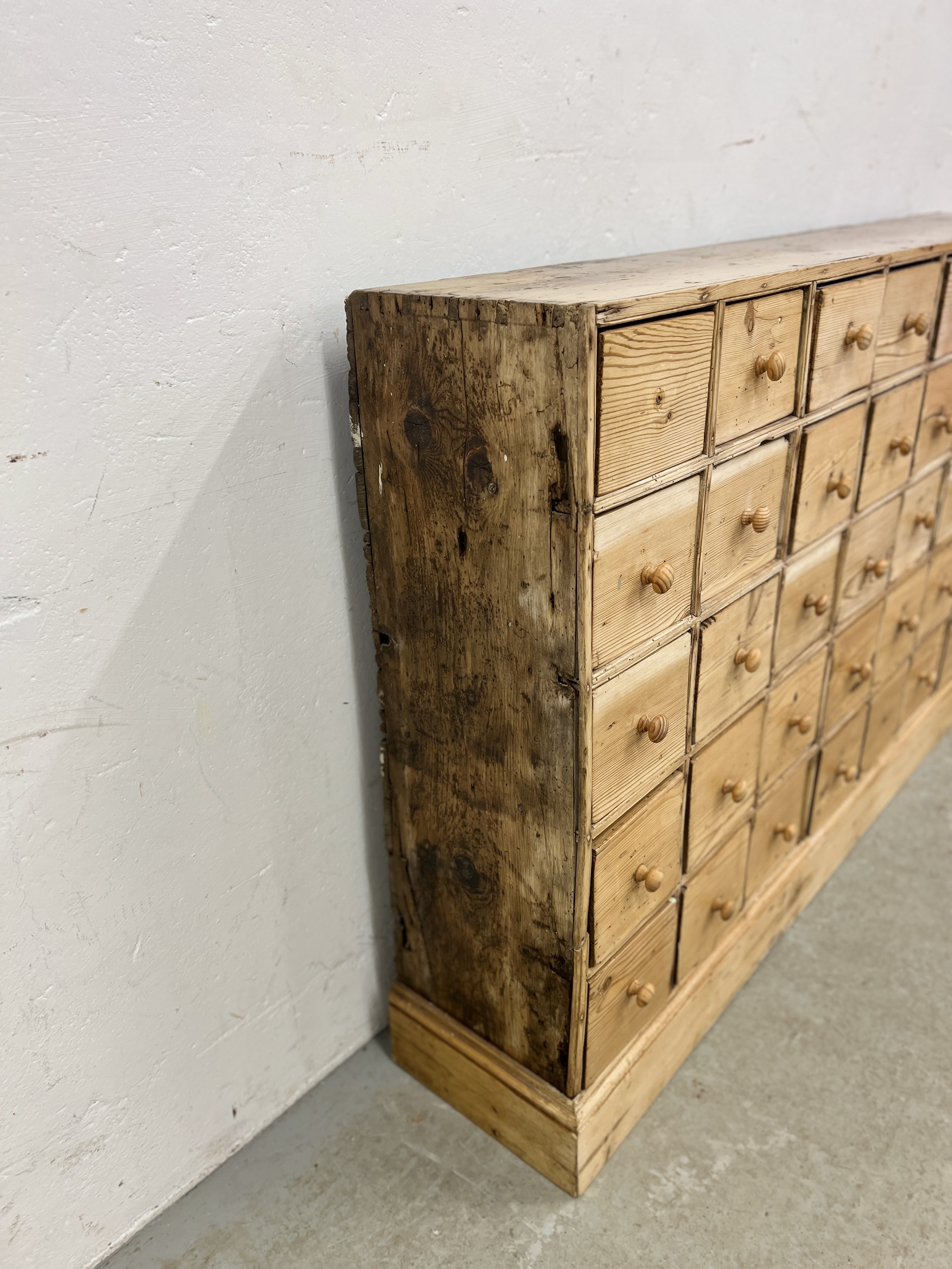 AN ANTIQUE PINE 40 DRAWER APOTHECARY / HABERDASHERY SHOP FITMENT - W 135CM X D 25CM X H 83CM. - Image 5 of 14