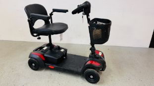 A COMPACT FOLDING ELECTRIC MOBILITY SCOOTER COMPLETE WITH CHARGER AND KEY - SOLD AS SEEN