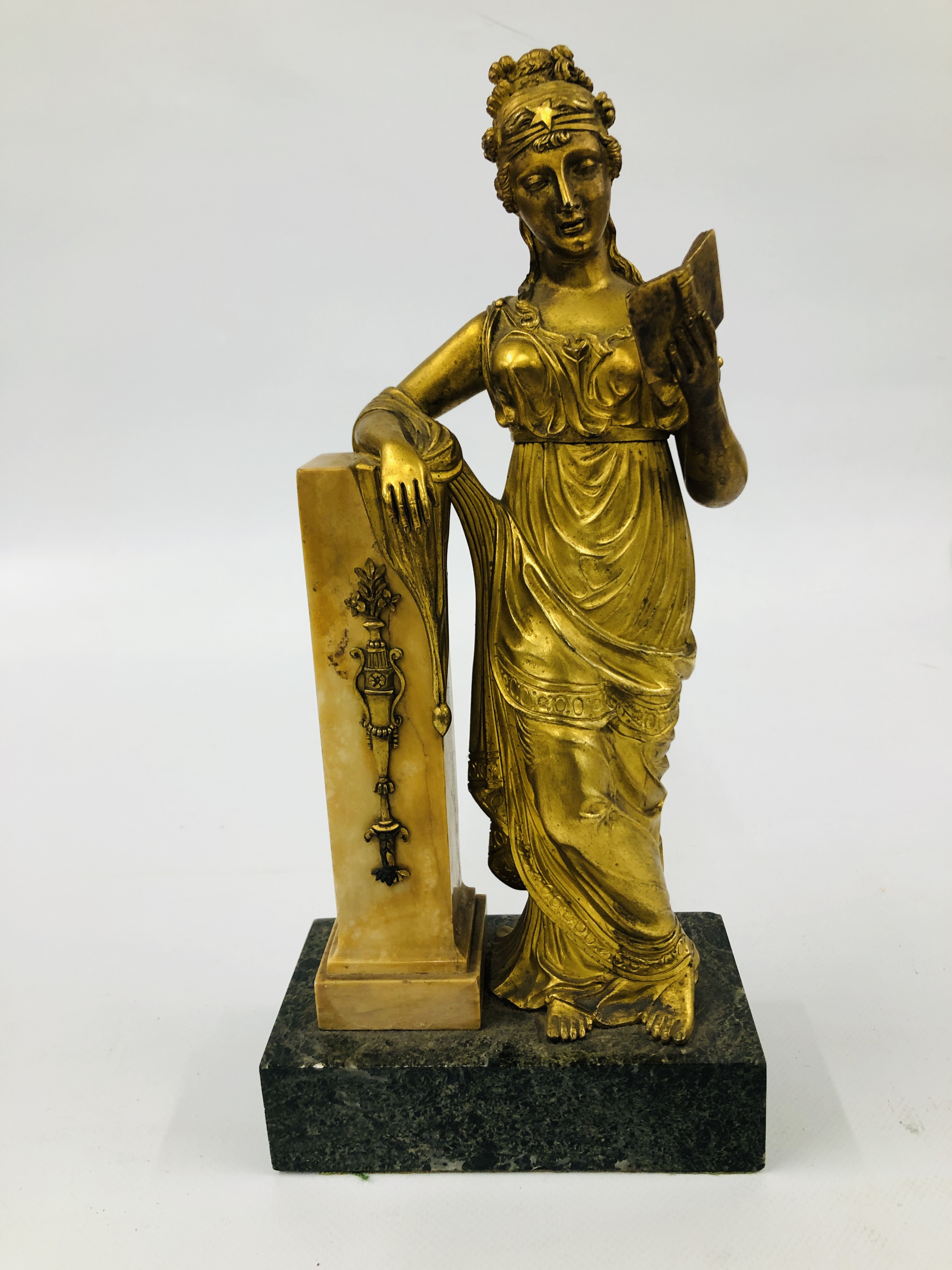 A BELLE EPOQUE GILT BRONZE FIGURE OF A STANDING WOMAN IN CLASSICAL DRESS, READING FROM A BOOK,