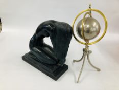 A PLASTER SCULPTURE OF A KNEELING WOMAN ALONG WITH A STEEL AND BRASS ARMILLARY SPHERE.