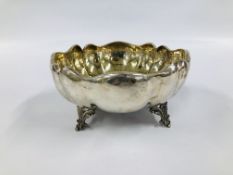 A SILVER AND GILT FRUIT BOWL, CIRCULAR LOBED MOLDED BORDER ON FOUR OPENWORK SCROLL FEET, DIA.