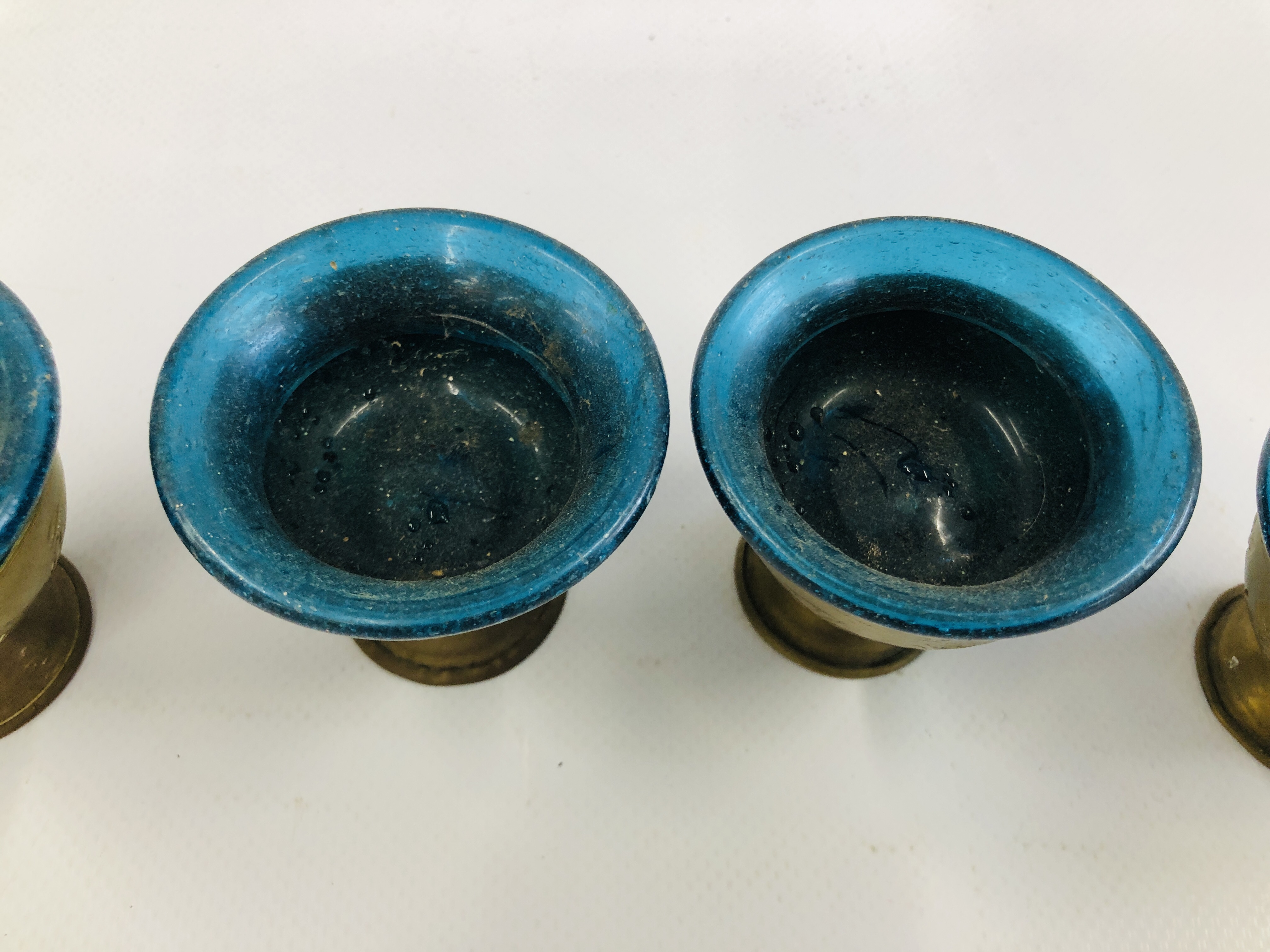 A SET OF SIX MIDDLE EASTERN BRASS GOBLET VESSELS WITH BLUE GLASS LINERS. - Image 6 of 11