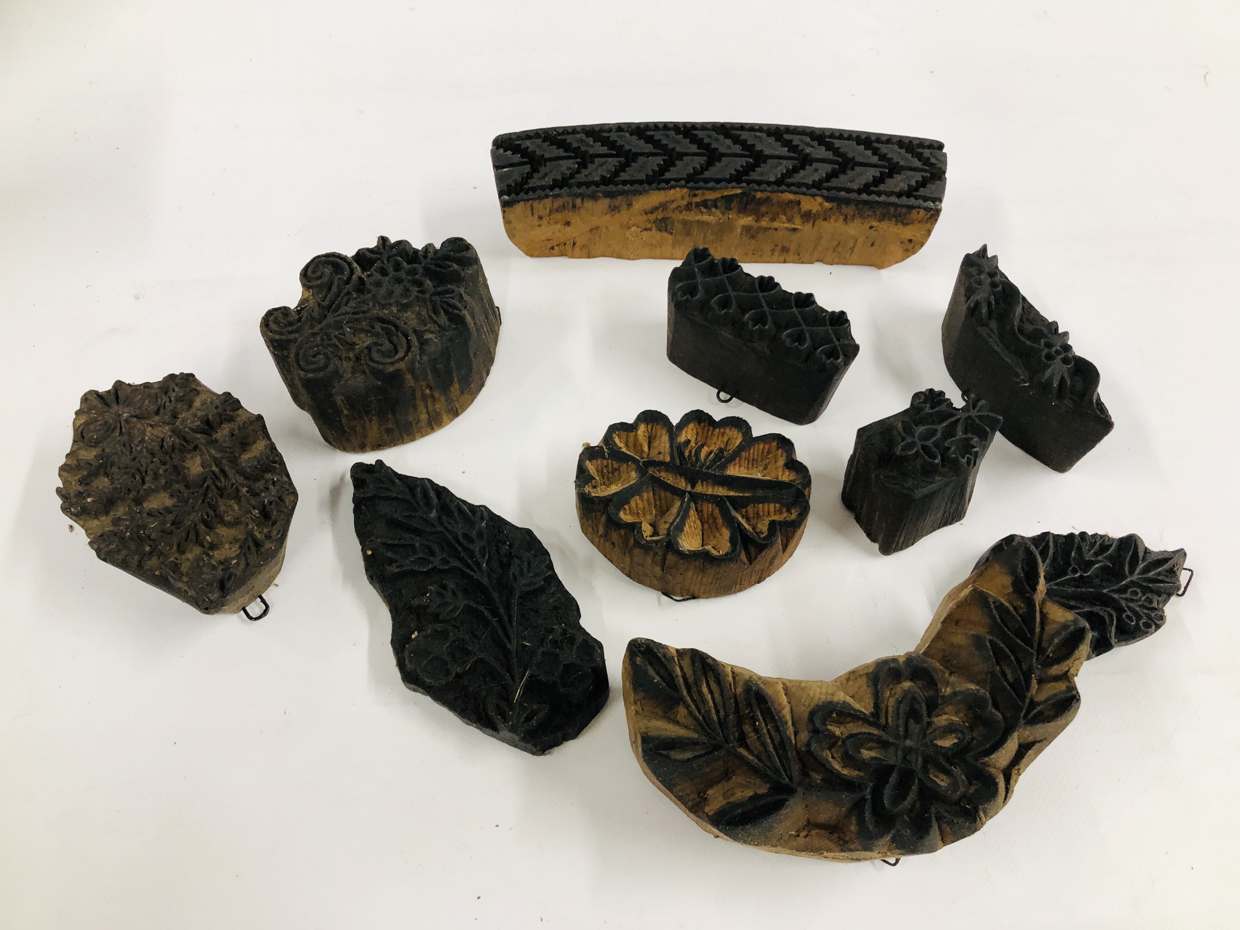 A COLLECTION OF TEN WOODEN PRINTING BLOCKS