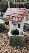 A STONEWORK WISHING WELL GARDEN FEATURE HEIGHT 95CM AND A STONEWORK PLAQUE.