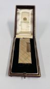 A 9CT GOLD DUNHILL CIGARETTE LIGHTER IN ORIGINAL LEATHERED PRESENTATION BOX.