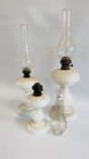 A GROUP OF THREE VINTAGE GRADUATED WHITE GLASS OIL LAMPS