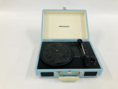 A CROSLEY REPRODUCTION TRANSPORTABLE RECORD PLAYER IN BABY BLUE CASE COMPLETE WITH TRANSFORMER -