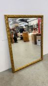 A LARGE BEVEL EDGE GILT FRAMED MIRROR, 85CM X 110CM.