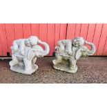 A PAIR OF GARDEN STONEWORK ELEPHANTS CARRYING A CHILD