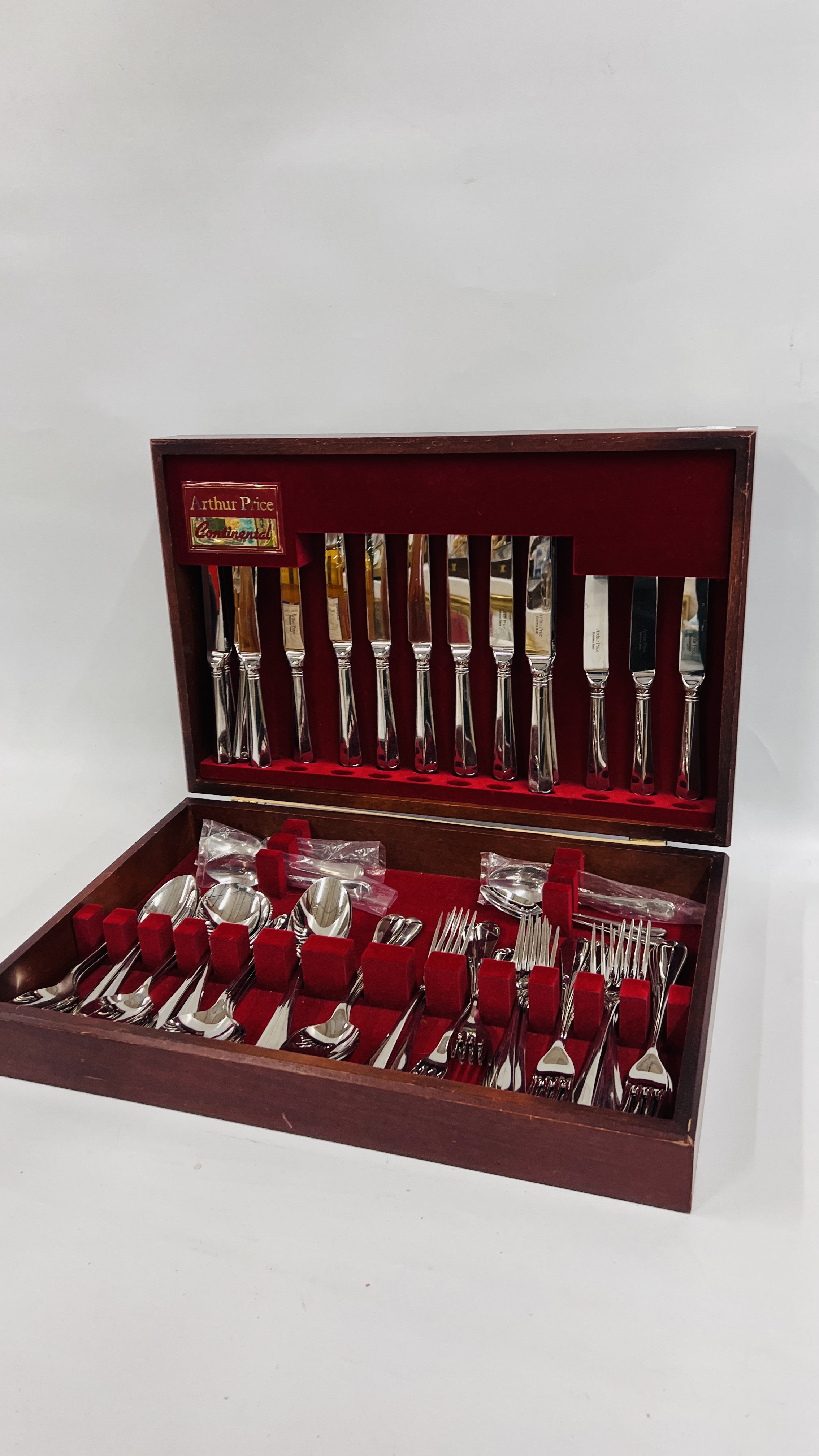 CASED CANTEEN OF ARTHUR PRICE CONTINENTAL STAINLESS STEEL CUTLERY, NOT COMPLETE.