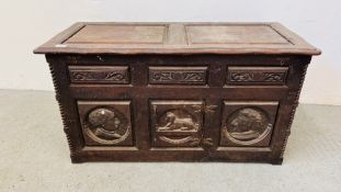 A SOLID OAK ANTIQUE CHEST WITH HAND CARVED PORTRAIT PANELS THE CENTRAL PANEL DEPICTING A SPHINX