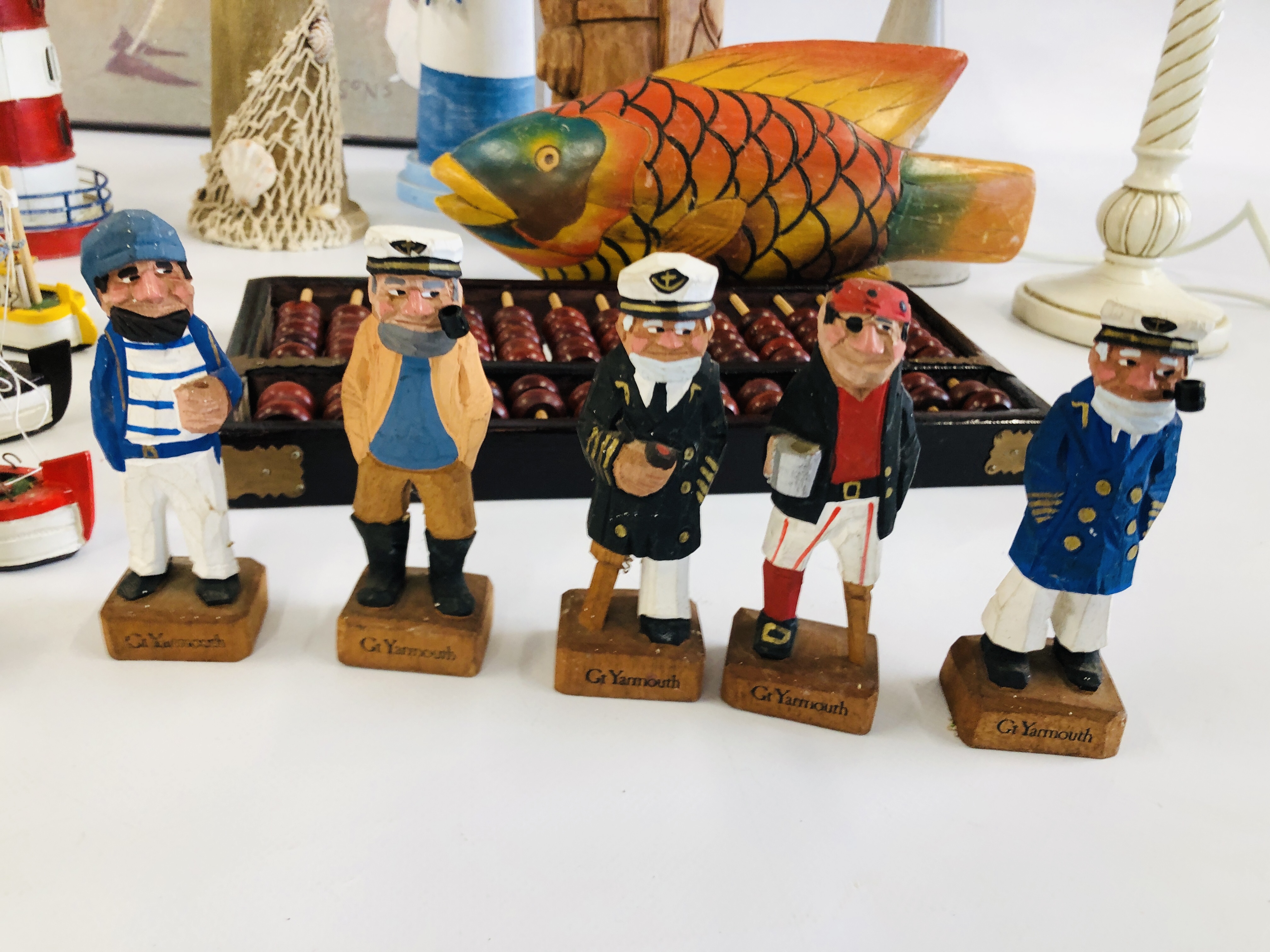 A GROUP OF DECORATIVE EFFECTS TO INCLUDE WOODEN LIGHTHOUSE, WOODEN FISH, WOODEN FISHERMAN FIGURES, - Image 2 of 8