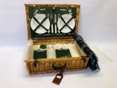 AN "OPTIMA" WICKER PICNIC BASKET AND CONTENTS.