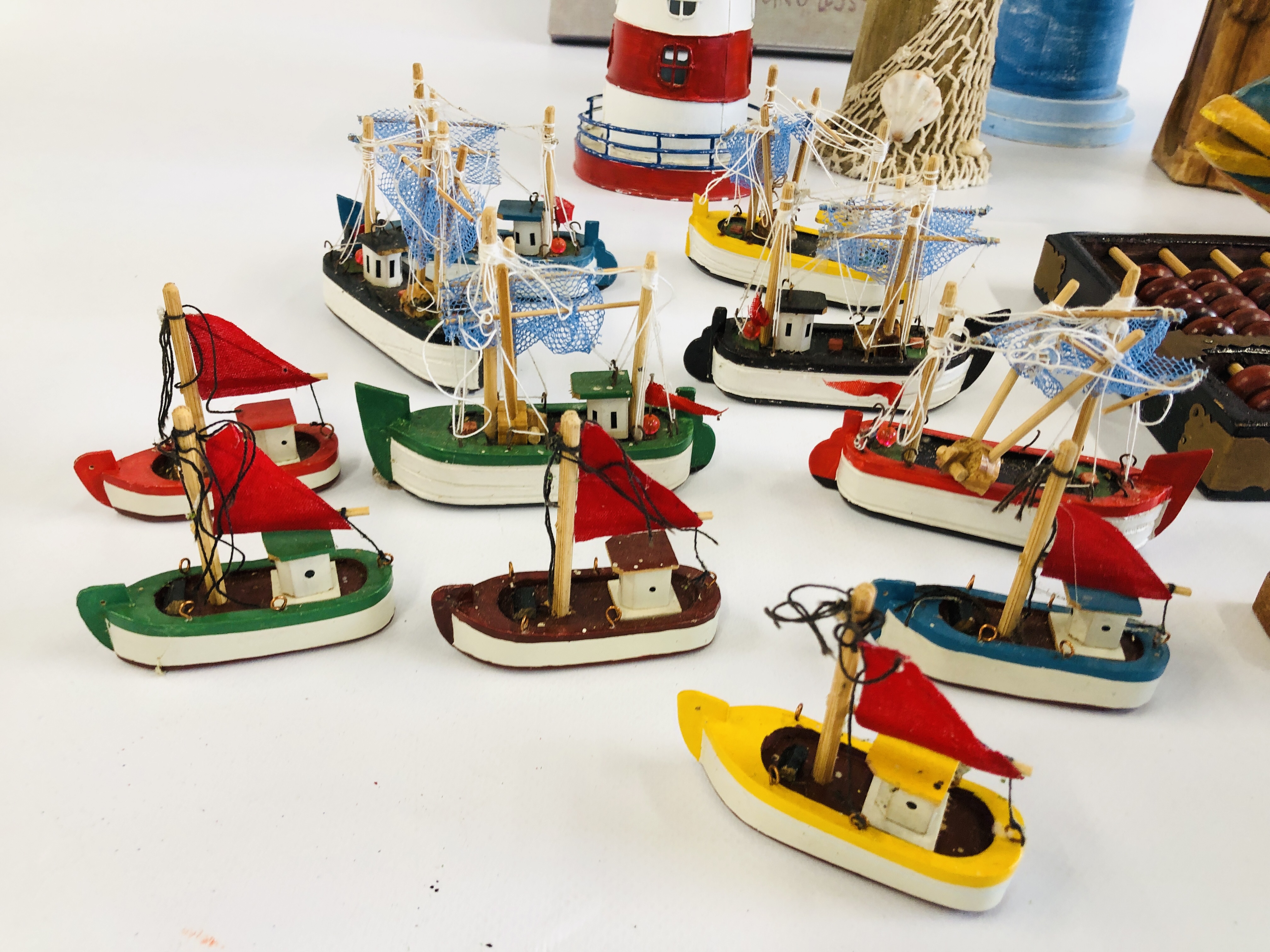 A GROUP OF DECORATIVE EFFECTS TO INCLUDE WOODEN LIGHTHOUSE, WOODEN FISH, WOODEN FISHERMAN FIGURES, - Image 3 of 8