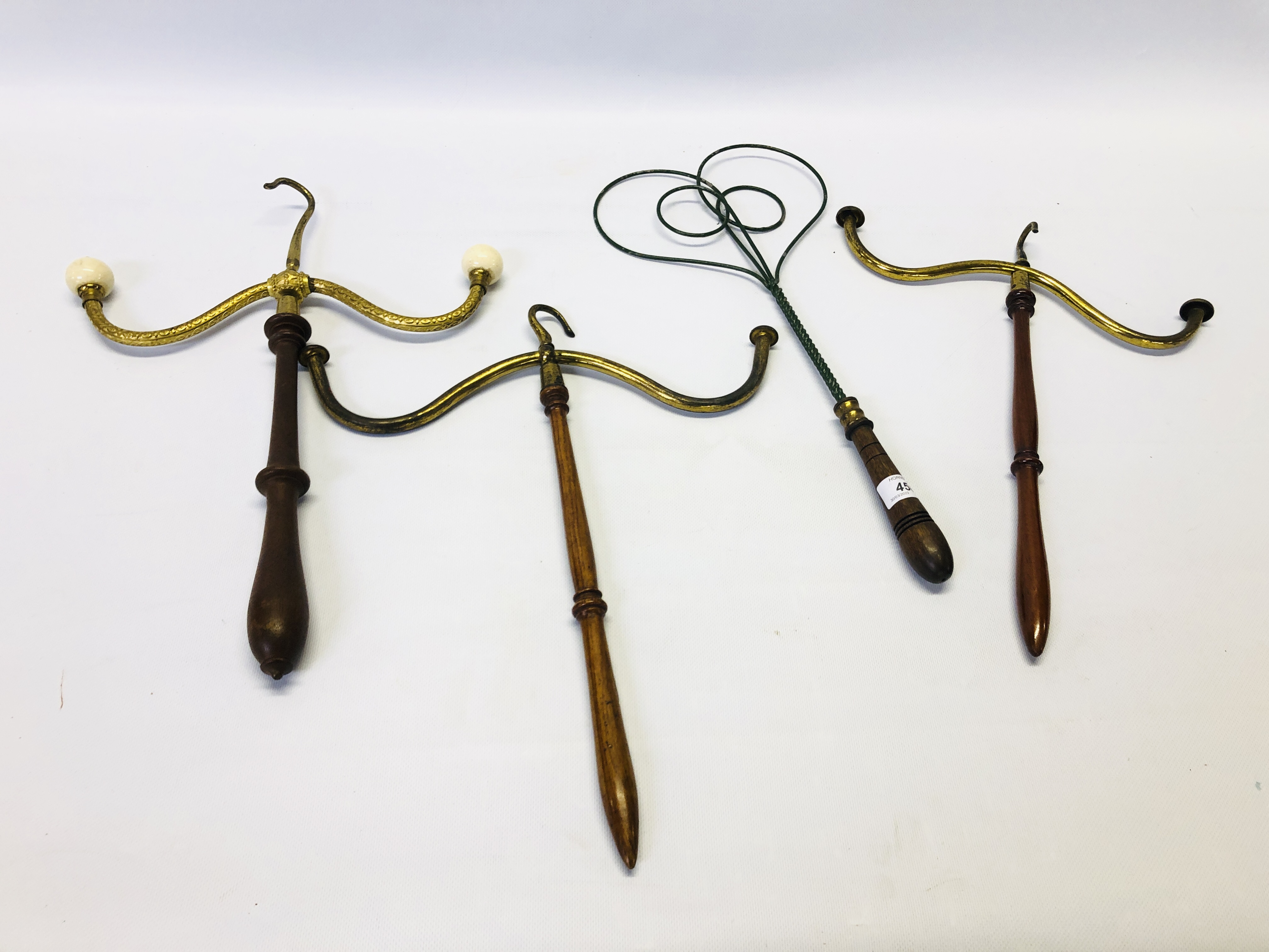 A GROUP OF 4 VINTAGE BARRISTER HANGING WIG AND GOWN HANGERS.