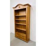 A SOLID PINE 4 TIER BOOKSHELF WITH SHAPED TOP AND 2 DRAWER BASE - W 105CM X D 35CM X H 201CM.