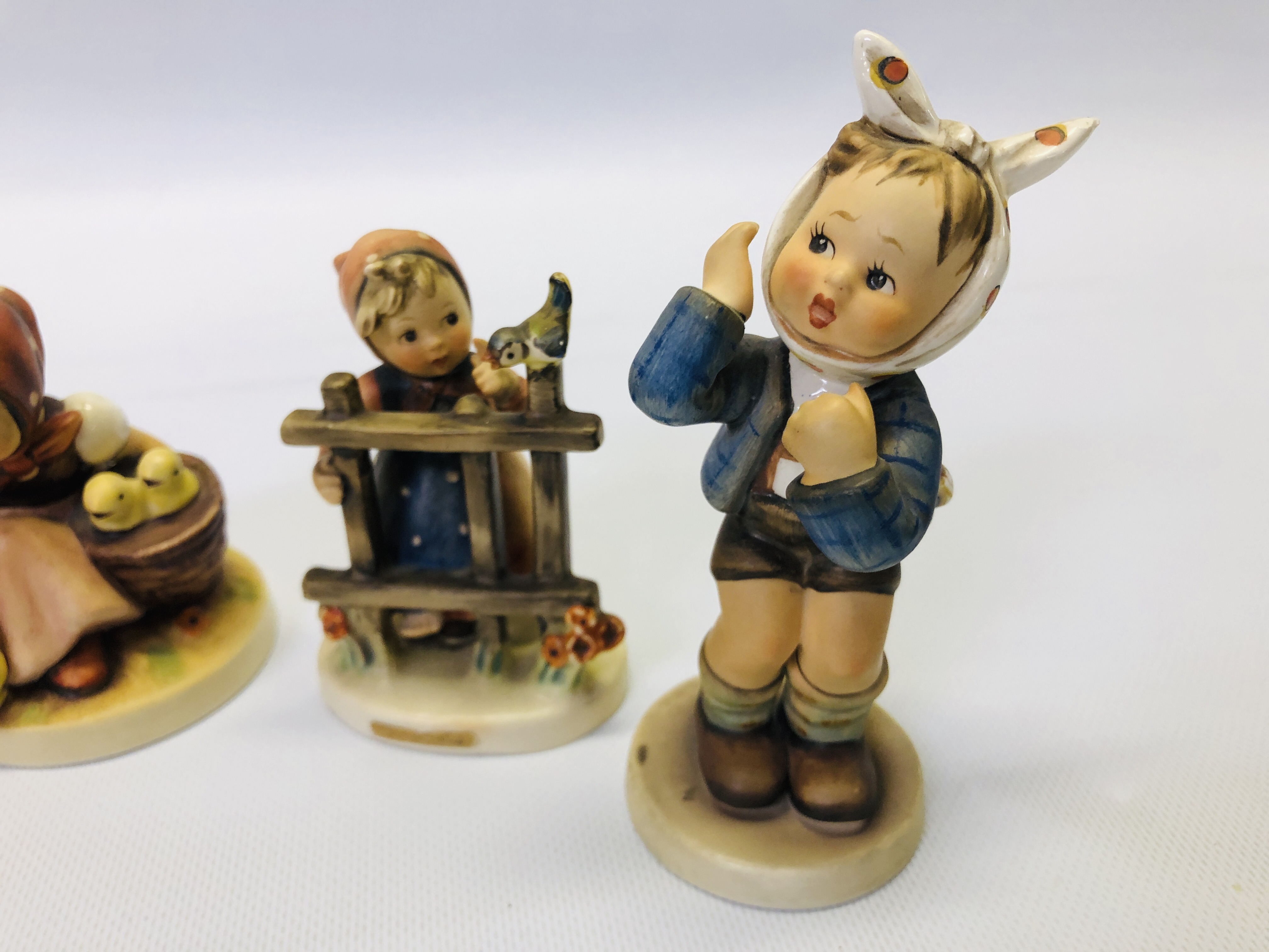 A GROUP OF 6 ASSORTED "GOEBEL" CABINET ORNAMENTS TO INCLUDE TWO EXAMPLES OF A SEATED CHILD WITH - Image 2 of 9
