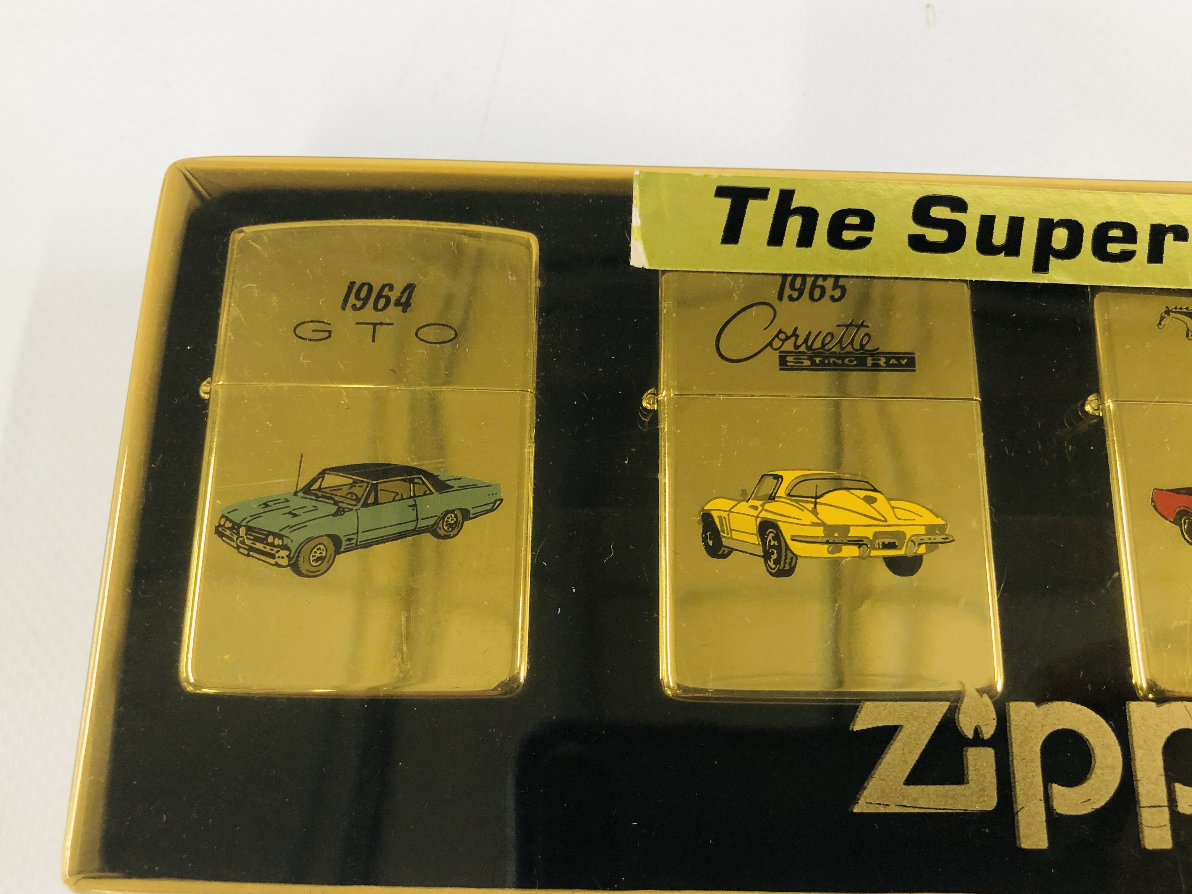 A BOXED "THE SUPER 60'S" ZIPPO LIGHTER SET ALONG WITH ONE FURTHER CORVETTE EXAMPLE. - Image 2 of 4