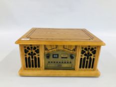 A REPRODUCTION "NOSTALGIC" DESIGN CD / RADIO / RECORD / CASSETTE MUSIC PLAYER - SOLD AS SEEN.