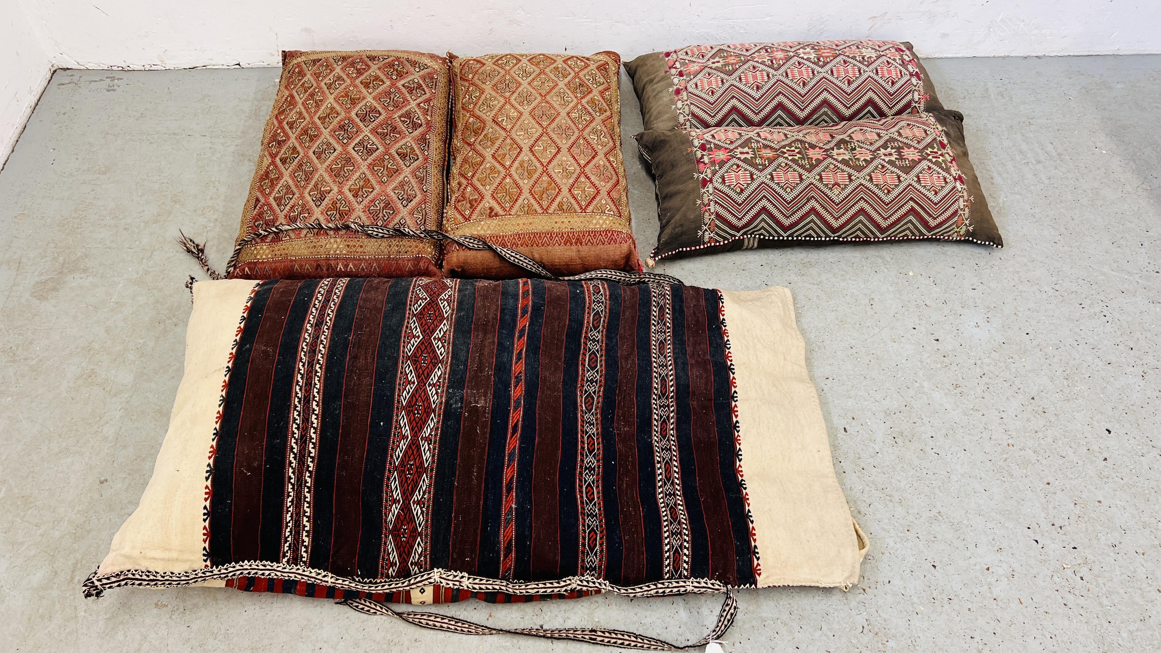 TWO PAIRS OF MIDDLE EASTERN HANDCRAFTS CUSHIONS ALONG WITH A FURTHER LARGER FLAT WEAVE EXAMPLE