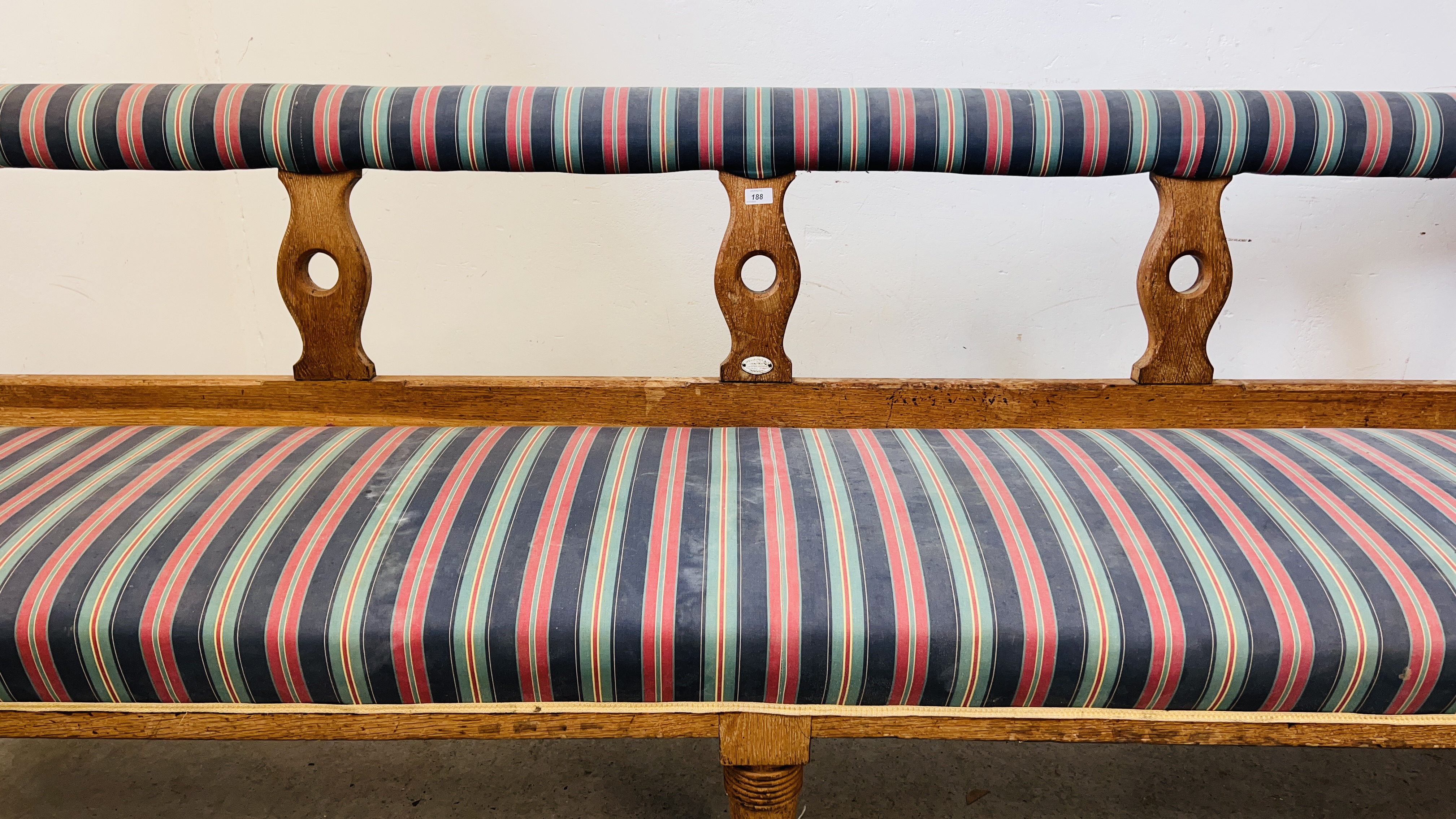 AN ANTIQUE OAK WAITING ROOM BENCH BEARING TREVOR PAGE & Co NORWICH CABINET MAKER LABEL, - Image 4 of 16