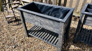 A GREY PAINTED RECLAIMED WOODEN RAISED TROUGH PLANTER PLASTIC LINED WITH LOWER SLATTED SHELVING