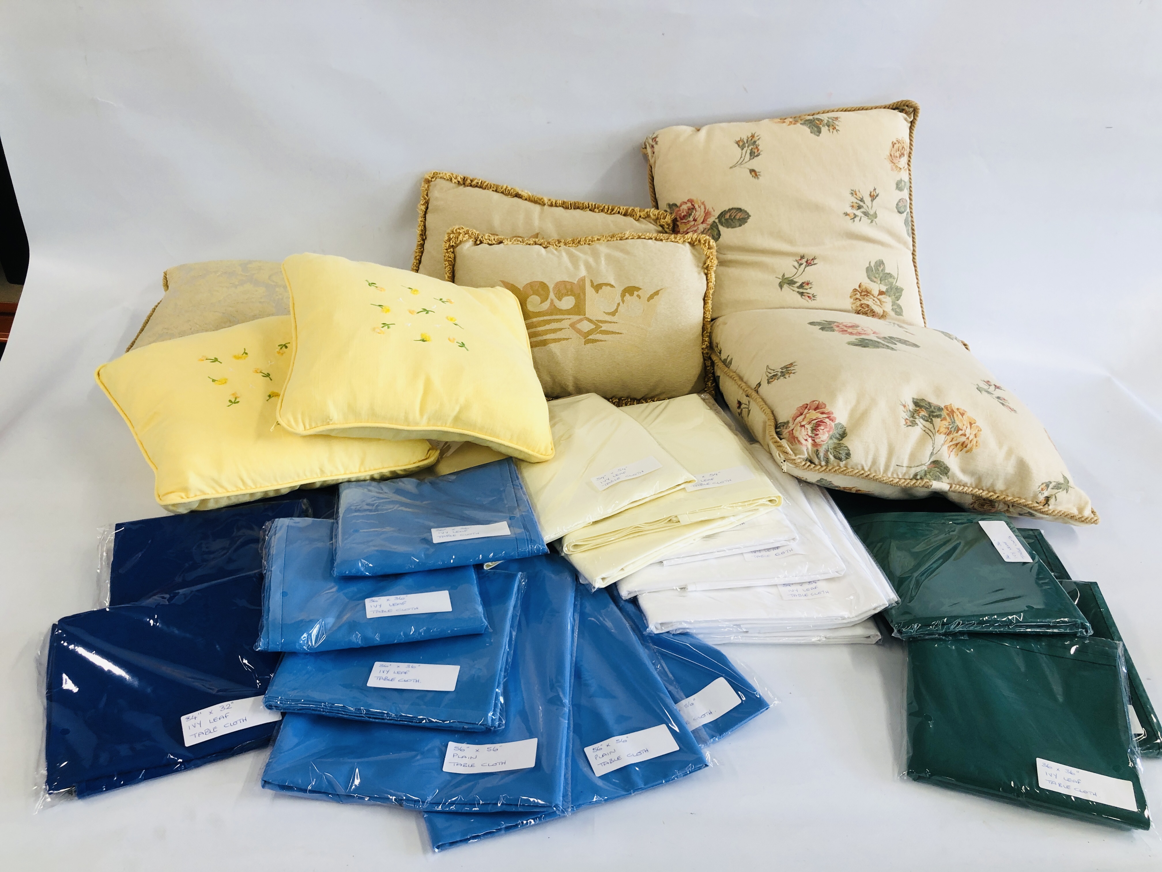 COLLECTION OF 7 LAURA ASHLEY CUSHIONS + SELECTION OF 23 TABLE CLOTHS: 3 OF 54" X 54" CREAM IVY LEAF