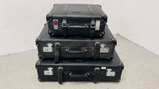 A GRADUATED SET OF THREE BOUND TRAVEL CASES "XK8".