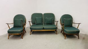 AN ERCOL 3 PIECE SUITE COMPRISING OF 2 SEATER SOFA AND 2 ARM CHAIRS.
