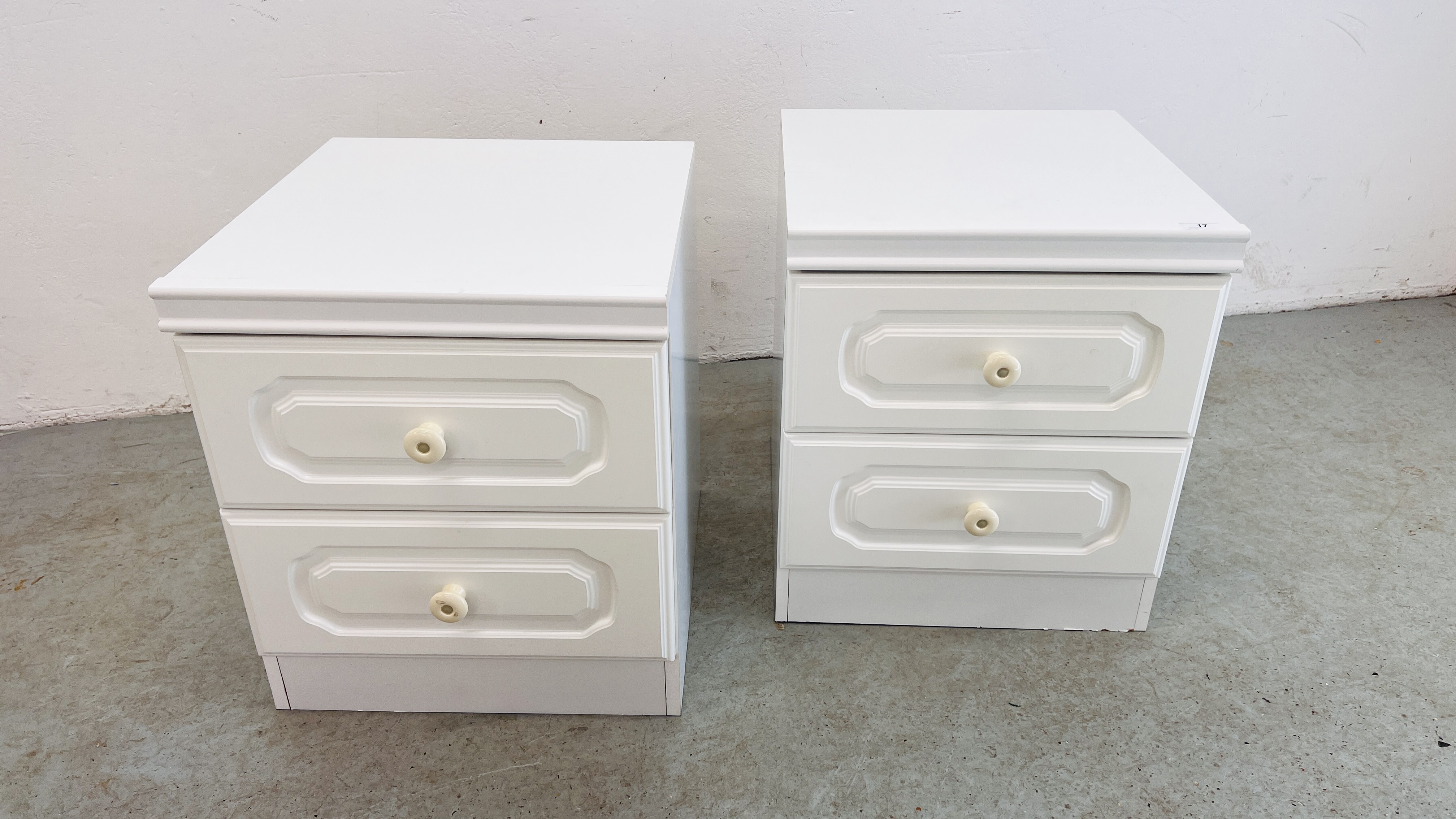 A PAIR OF WHITE FINISH 2 DRAWER BEDSIDE CABINETS.