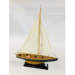 A SCRATCH BUILT MODEL OF A SAILING YACHT, H 58CM, L 43CM.