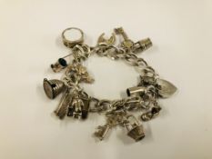 SILVER CHARM BRACELET WITH 13 CHARMS ATTACHED.