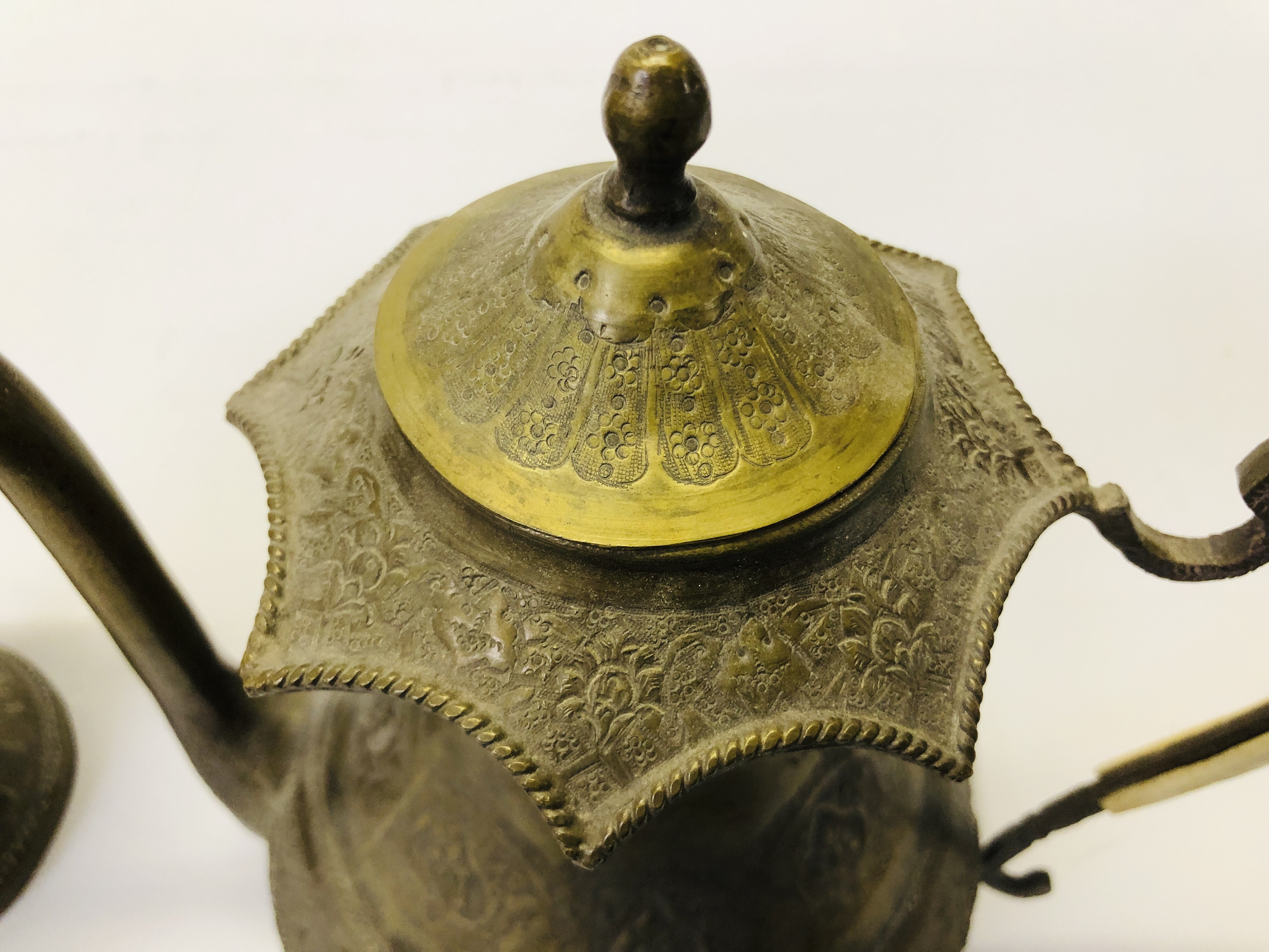 A VINTAGE MIDDLE EASTERN BRASS EWER ALONG WITH AN ELABORATE MIDDLE EASTERN BRASS COFFEE POT. - Image 2 of 21