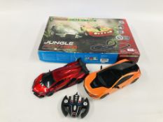 A BOXED MICRO SCALEXTRIC JUNGLE MAYHEM SET ALONG WITH 2 REMOTE CONTROL TRANSFORMER CARS (1 REMOTE)