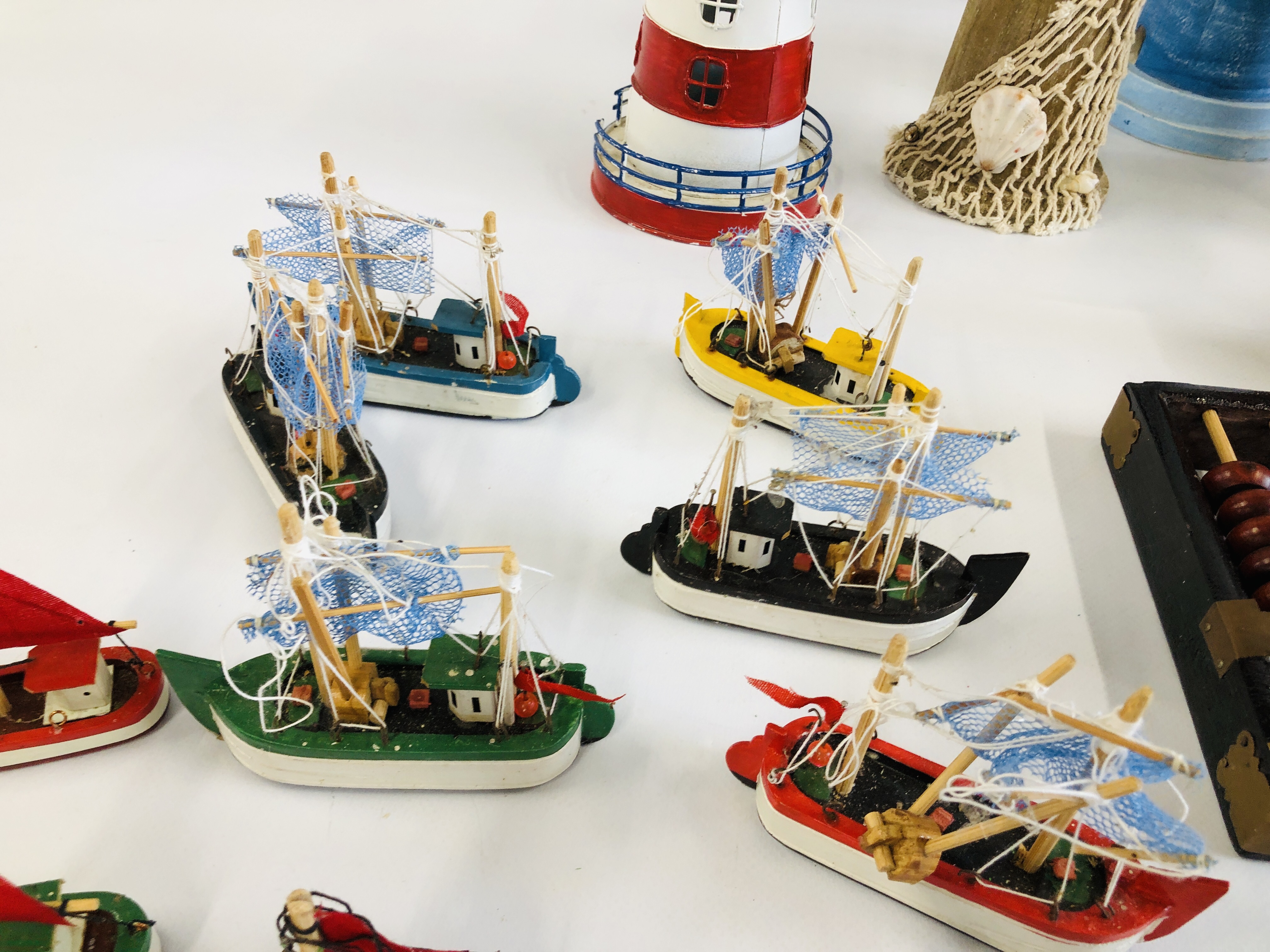 A GROUP OF DECORATIVE EFFECTS TO INCLUDE WOODEN LIGHTHOUSE, WOODEN FISH, WOODEN FISHERMAN FIGURES, - Image 4 of 8