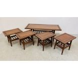A SUITE OF FIVE HARDWOOD OCCASIONAL TABLES WITH HAND CARVED DETAIL TO INCLUDE COFFEE TABLE 107CM.
