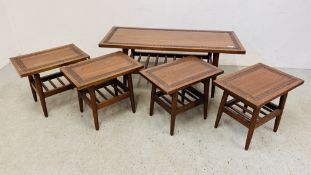 A SUITE OF FIVE HARDWOOD OCCASIONAL TABLES WITH HAND CARVED DETAIL TO INCLUDE COFFEE TABLE 107CM.