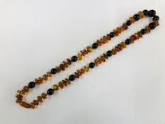 AN IMPRESSIVE STRAND OF POLISHED AMBER L 72CM.