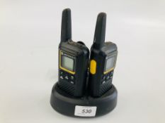 A PAIR OF MOTOROLA XTB446 WALKIE TALKIES IN CHARGING DOCKS - SOLD AS SEEN.