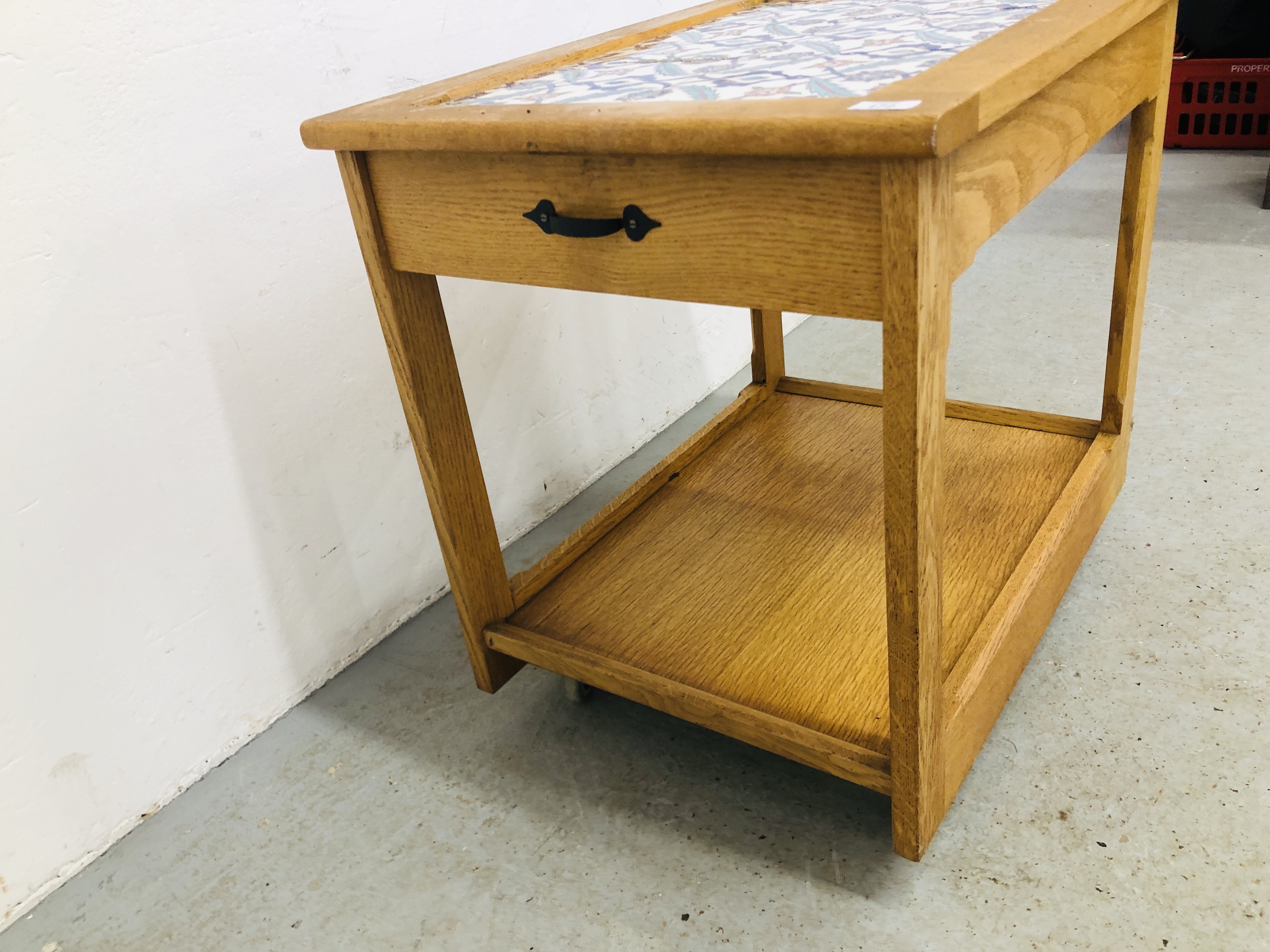 AN OAK TWO TIER TROLLEY THE TOP INSET WITH CERAMIC TILES, DRAWER TO END LENGTH 74CM. WIDTH 54CM. - Image 5 of 6