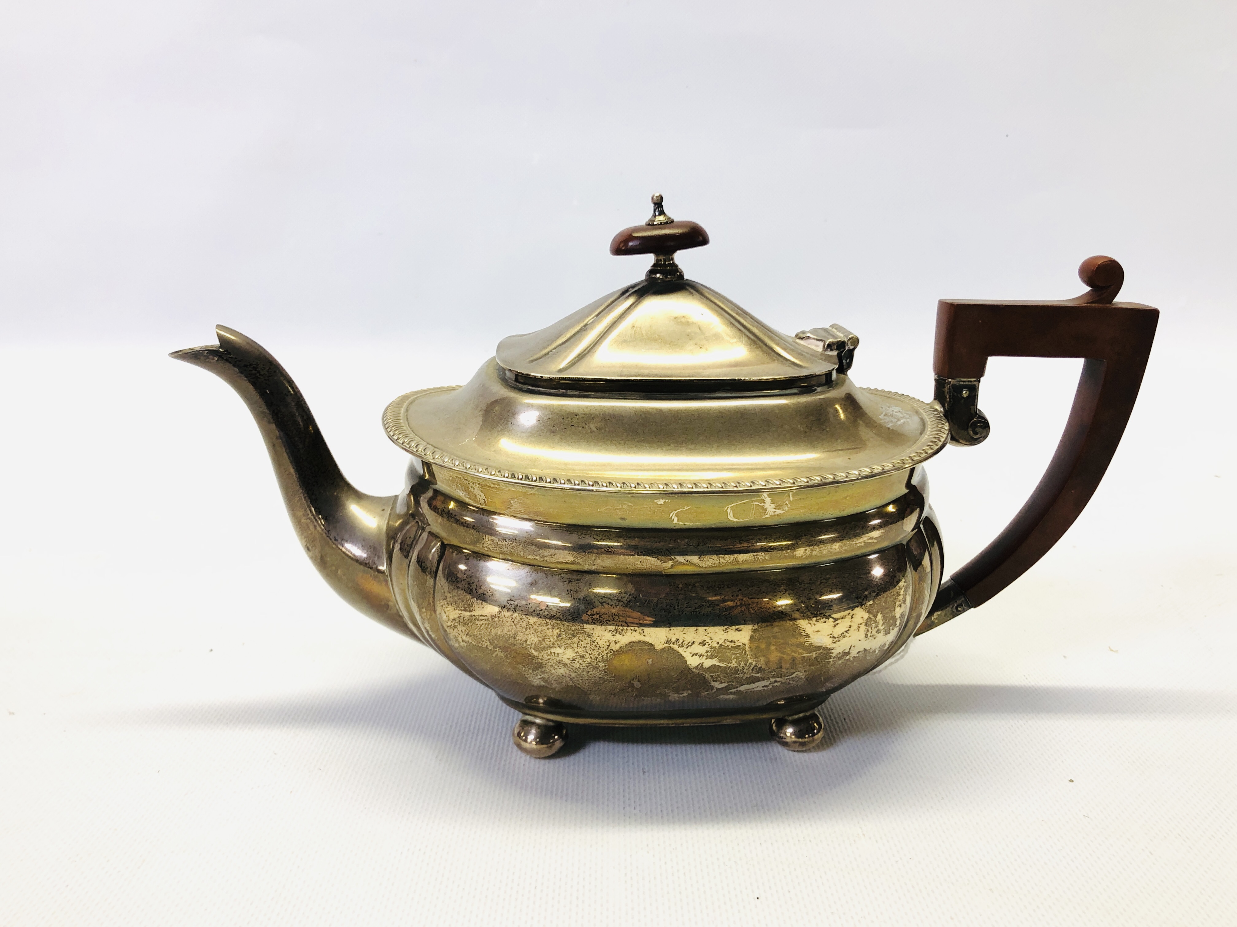 A SILVER TEAPOT,